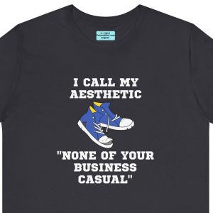 Unisex Tee with an old pair of sneakers and the caption: "I call my aesthetic None of Your Business Casual."
