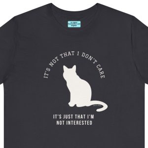 Unisex Tee with the image of a cat saying: "It's not that I don't care It's just that I'm not interested."