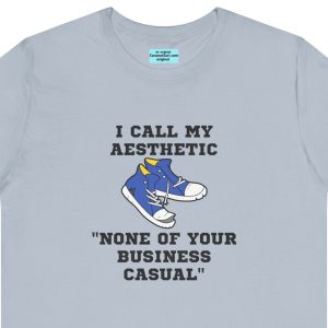 Unisex Tee with an old pair of sneakers and the caption: "I call my aesthetic None of Your Business Casual."