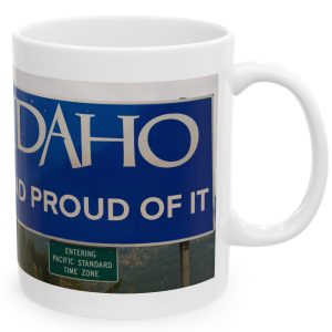 White Mug with fake state motto for Idaho: "Idaho and proud of it."