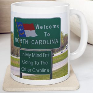 White Mug with fake state motto for North Carolina: "In My Mind I'm Going to the Other Carolina."