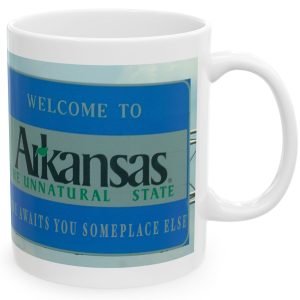 White Mug with fake state motto for Arkansas: "Fame Awaits You Someplace Else."