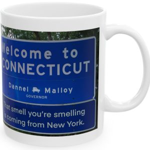 White Mug with fake state motto for Connecticut: "That smell you're smelling is coming from New York."