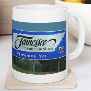 White Mug with fake state motto for Tennessee: "10% better than Ninesee."