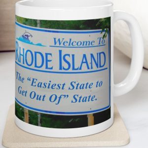White Mug with fake state motto for Rhode Island: "The Easiest State to Get Out of State."