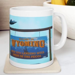 White Mug with fake state motto for Wyoming: "Best UFO Landing Sites West of the Pecos."